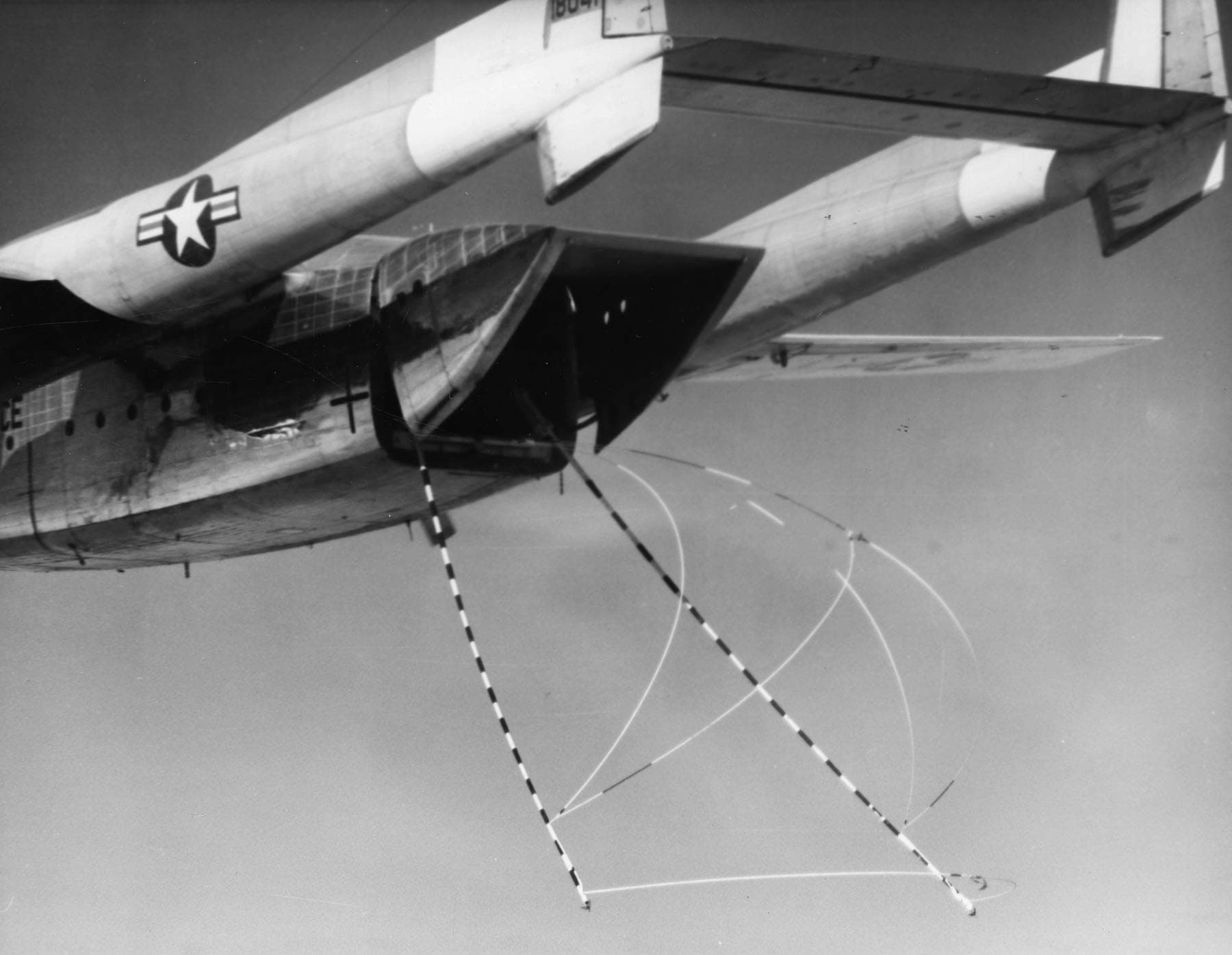 Satellite-catching trapeze gear deployed from a USAF C-119J recovery aircraft